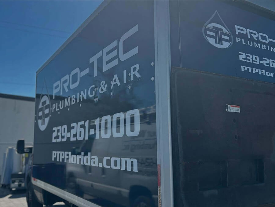 PRO-TEC Plumbing & Air service trailer parked outside company facility