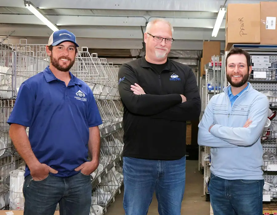 Three Pro-Tec team members at the company facility
