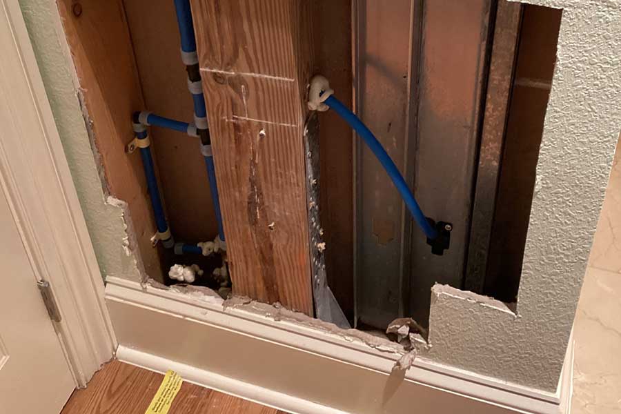 Water leak repair in Naples FL with exposed wall and new plumbing lines