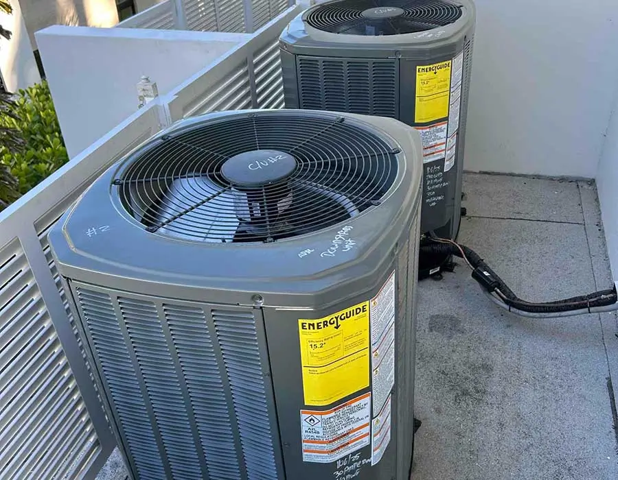 New heat pump units installed outside a Naples FL home