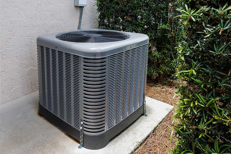 Outdoor AC unit ready for replacement service in Naples