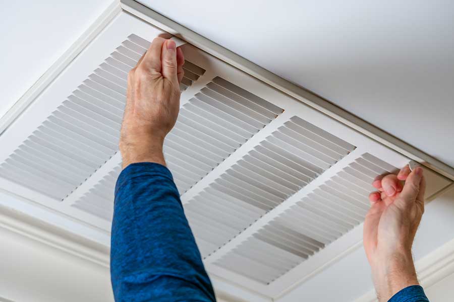 Cleaning air vents to improve airflow in a Naples FL home