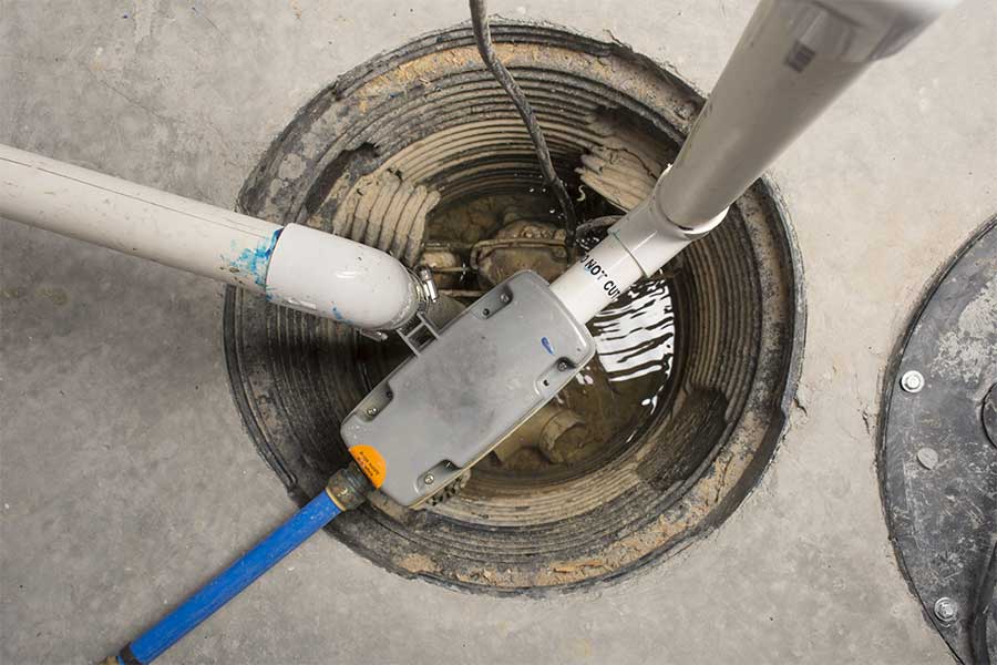 Sump pump installation underway in a Naples FL basement pit