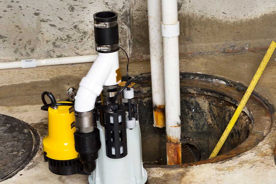 New sump pump ready for replacement in a Naples FL basement