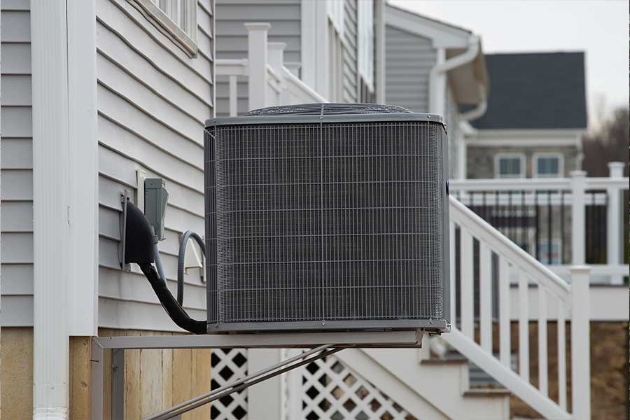 Heat pump installed outside home in Marco Island FL