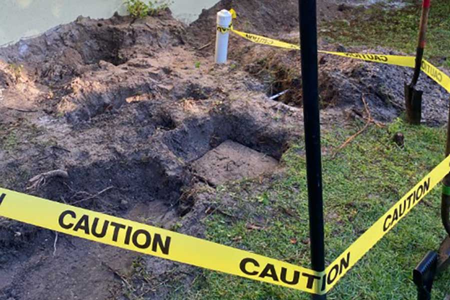 Caution tape around an emergency plumbing repair in Fort Myers