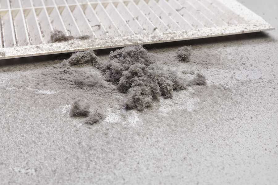 Dirty air vent with excessive dust before duct sealing in Naples, FL