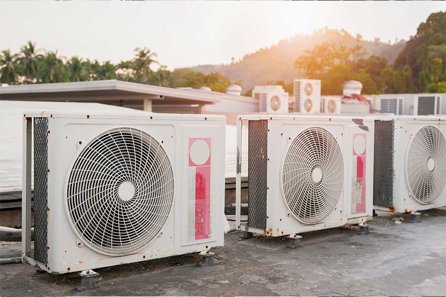Commercial air conditioning units installed on a business rooftop