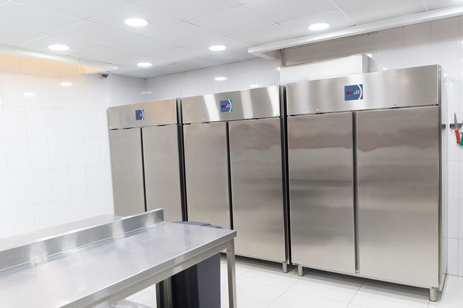 Stainless steel commercial refrigerators serviced during an emergency refrigeration repair