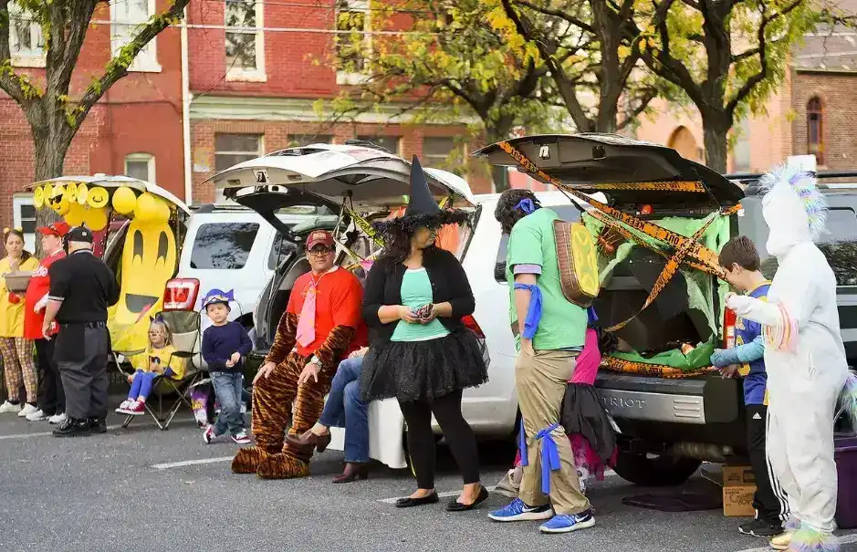 Crowd enjoying the Avowloween Trunk-or-Treat event with festive Halloween decorations