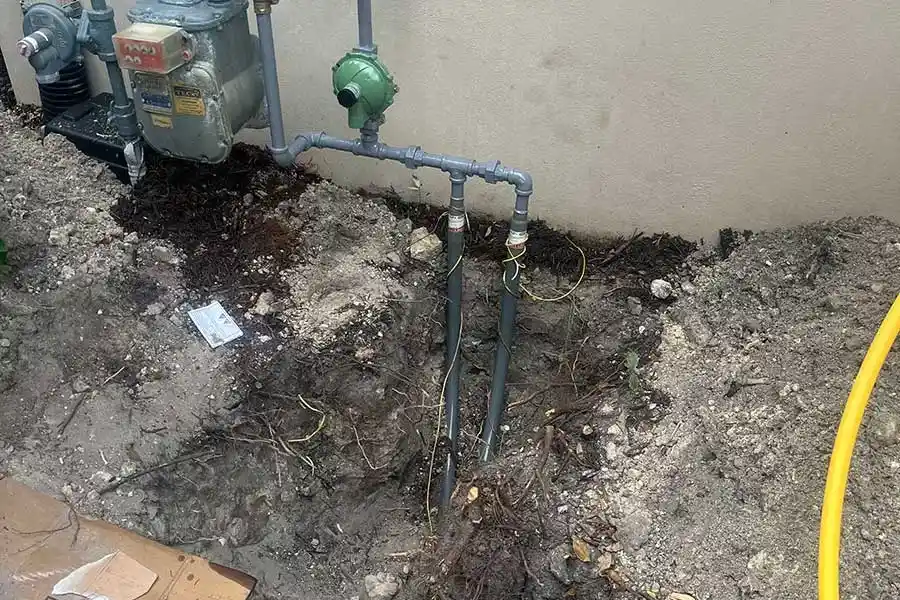 Gas line repair in Naples FL with newly installed piping in excavated area