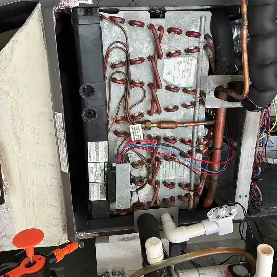 Evaporator coil cleaned and inspected as part of residential AC maintenance in Naples, FL